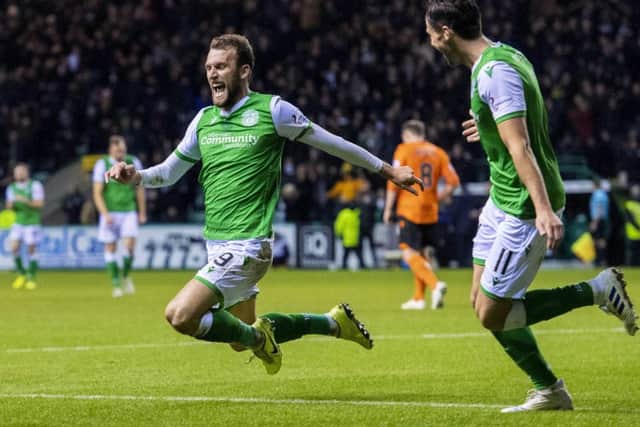 Hibs hat-trick hero Christian Doidge launches himself into a knee slide to celebrate his first goal in last nights 4-2 win over Dundee United at Easter Road last night. Picture: Alan Harvey/SNS