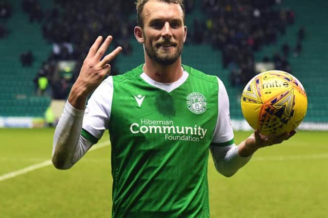 Christian Doidge celebrates with the match ball after his hat-trick. Picture: SNS