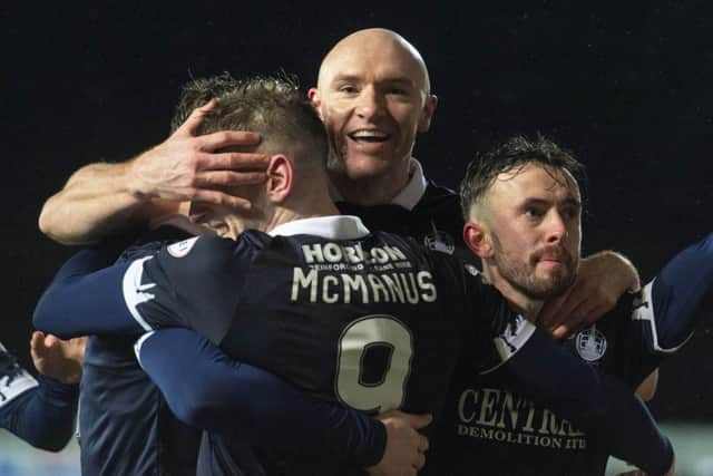 Conor Sammon celebrates with his teammates after making it 2-0 to Falkirk. Picture: Mark Scates / SNS