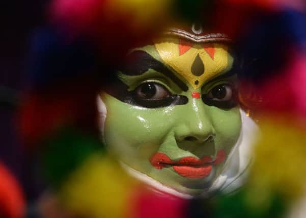 An artist prepares for a performance of Kathakali, a classical dance created in Keralas ancient kingdoms (Picture: Arun Sankar/AFP/Getty Images)