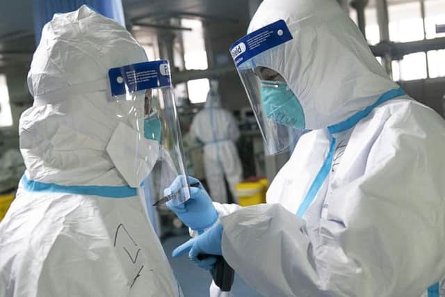 Experts in China have said there is evidence that people could transmit the virus without showing any symptoms. Picture: AP