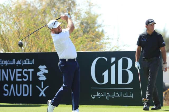 Graeme McDowell shot his six-under-par 64 in the company of Phil Mickelson in the first round of the Saudi International at Royal Greens Golf Club in King Abdullah Economic City