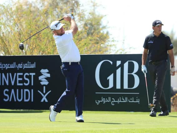 Graeme McDowell shot his six-under-par 64 in the company of Phil Mickelson in the first round of the Saudi International at Royal Greens Golf Club in King Abdullah Economic City
