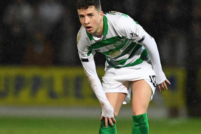 Celtic's Mikey Johnston was forced off with a knee injury. Picture: Craig Williamson/SNS
