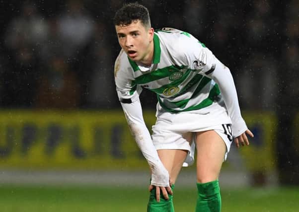 Celtic's Mikey Johnston was forced off with a knee injury. Picture: Craig Williamson/SNS