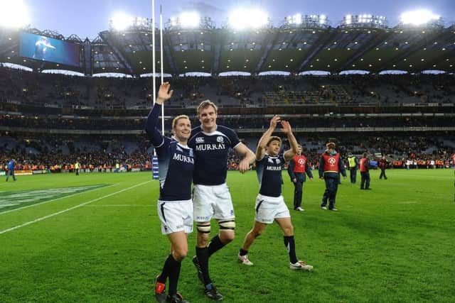 Dan Parks, Al Kellock and Chris Cusiter delebrate victory over Ireland at Croke Park in 2010. Picture: Getty.