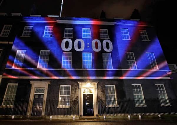 A digital Brexit countdown clock shows 00:00 as the time reaches 11 o'clock, as it is projected onto the front of 10 Downing Street. Picture: Getty