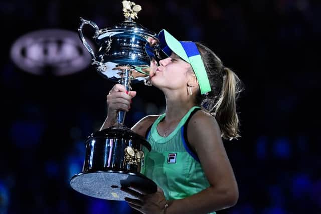 Sofia Kenin kisses the Daphne Akhurst Memorial Cup after beating Spain's Garbine Muguruza to win the Australian Open. Picture: Saeed Khan / AFP
