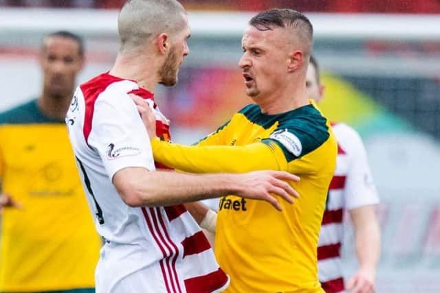 Alex Gogic and Leigh Griffiths square up to each other after the Celtic striker's foul on Sam Woods