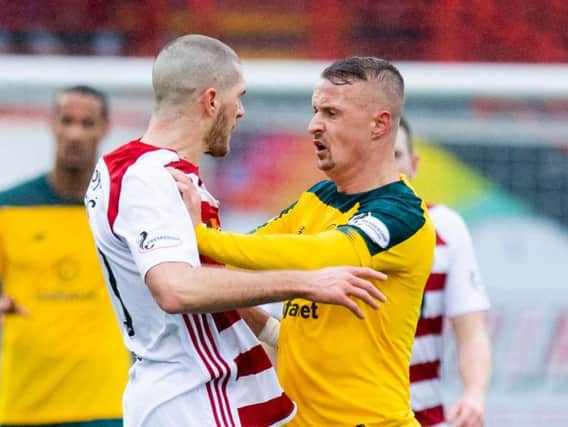 Alex Gogic and Leigh Griffiths square up to each other after the Celtic striker's foul on Sam Woods