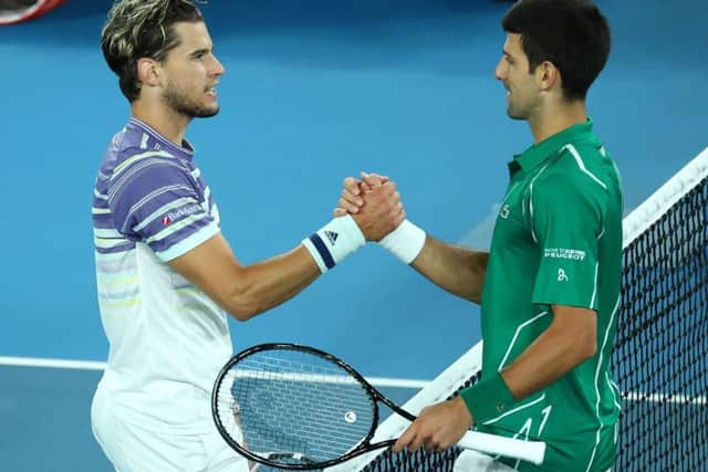 Novak Djokovic, right, and Dominic Thiem meet at the net following the Australian Open Men's Singles Final. Picture: Cameron Spencer/Getty