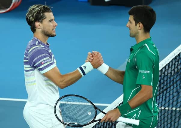 Novak Djokovic, right, and Dominic Thiem meet at the net following the Australian Open Men's Singles Final. Picture: Cameron Spencer/Getty