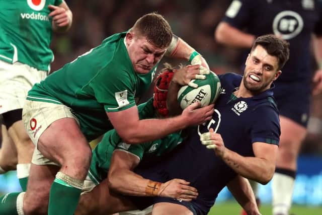 Adam Hastings is stopped by two Ireland forwards. Picture: Niall Carson/PA Wire