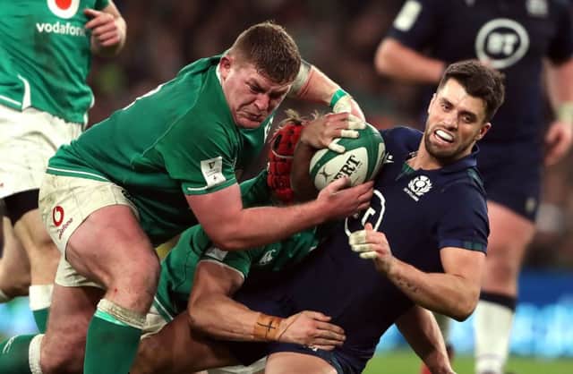 Adam Hastings is stopped by two Ireland forwards. Picture: Niall Carson/PA Wire