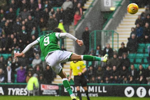 Hibs striker Christian Doidge heads home his 15th goal of the season to put the Easter Road side back on level terms against St Mirren on Saturday. Picture: Craig Foy/SNS