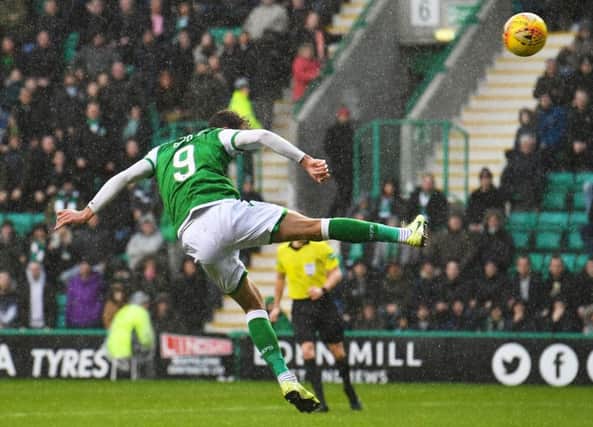 Hibs striker Christian Doidge heads home his 15th goal of the season to put the Easter Road side back on level terms against St Mirren on Saturday. Picture: Craig Foy/SNS