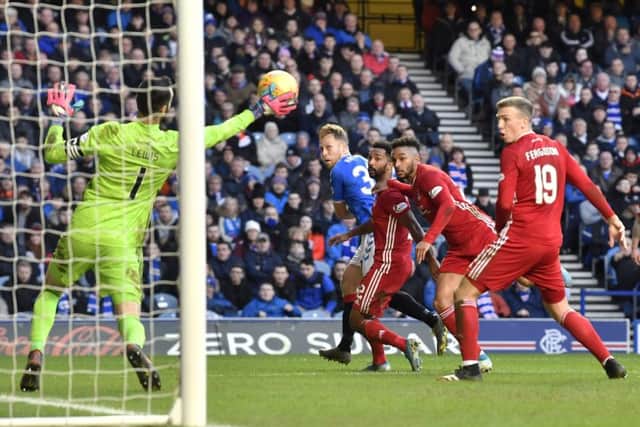 Aberdeen goalkeeper Joe Lewis denies Scott Arfield in Saturday's 0-0 draw at Ibrox. Picture: Rob Casey/SNS