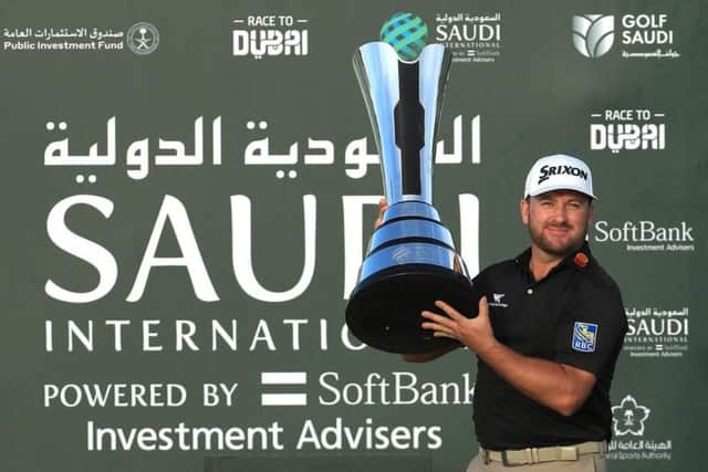 Graeme McDowell shows off the magnificent Saudi International Trophy after his win at Royal Greens Golf Club in King Abdullah Economic City
