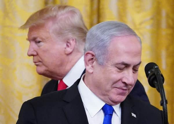 US President Donald Trump and Israel's Prime Minister Benjamin Netanyahu take part in an announcement of Trump's Middle East peace plan in the White House (Picture: Mandel Ngan/AFP via Getty Images)