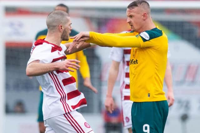 Leigh Griffiths is confronted by Alex Gogic after the alleged stamp on Sam Woods. Picture: SNS