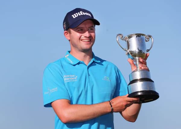 David Law, with the ISPS Handa Vic Open trophy he won last year, hopes this week in Australia will be fun after the Desert Swing. Picture: Getty