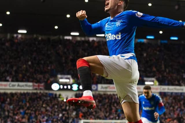 Ianis Hagi jumps for joy after scoring the winner against Hibs