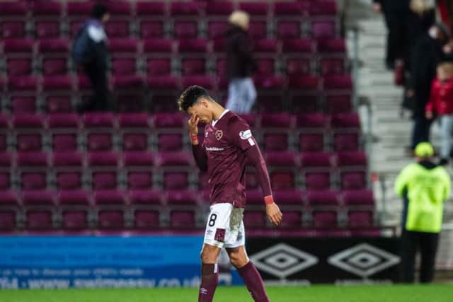 Sean Clare is a picture of dejection as he trudges off the pitch at full time