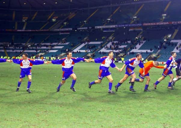 Inverness Caley Thistle players run towards their fans in joy after the final whistle sounded on their shock 3-1  Scottish Cup victory over Celtic at Parkhead 20 years ago. Picture: SNS.