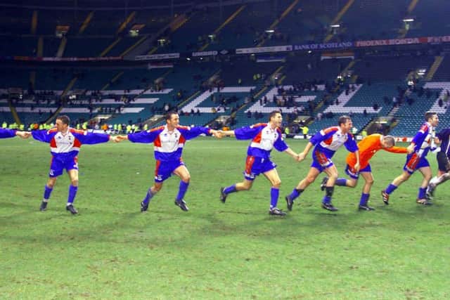 Inverness Caley Thistle players run towards their fans in joy after the final whistle sounded on their shock 3-1 Scottish Cup victory over Celtic at Parkhead 20 years ago. Picture: SNS.