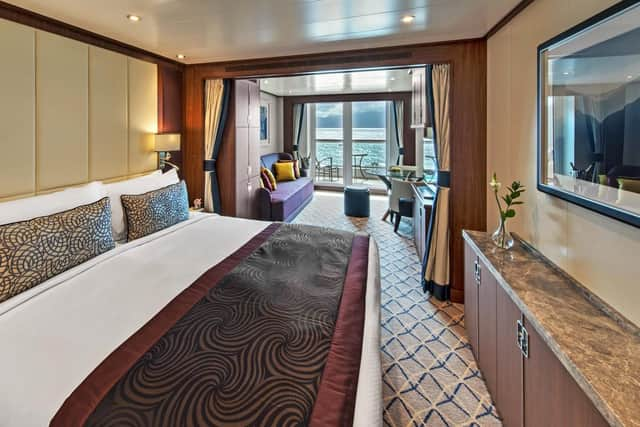 Seabourn Ovation Veranda Suite, with lounge area, doors to veranda, separate bathroom and walk-in wardrobe/storage