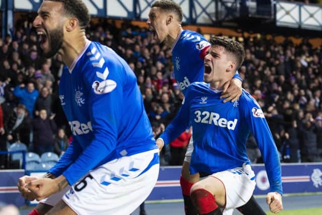 Ianis Hagi, right, celebrates his winner against Hibs. Picture: Alan Harvey / SNS