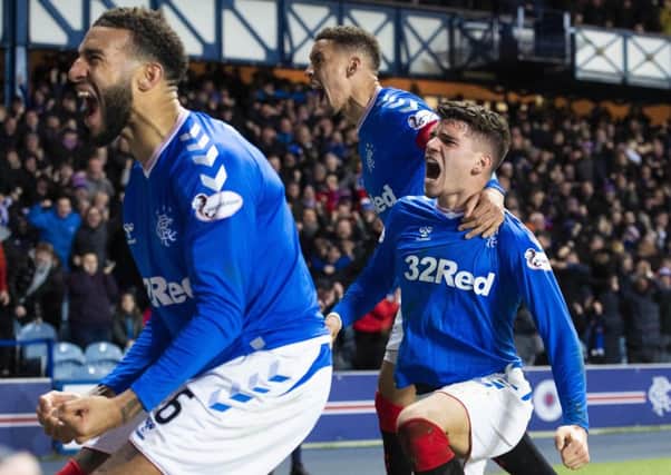 Ianis Hagi, right, celebrates his winner against Hibs. Picture: Alan Harvey / SNS