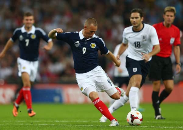 One of Kenny Miller's finest goals as he sweeps the ball home against England at Wembley in his final appearance for Scotland in 2013. Picture: Clive Mason/Getty Images