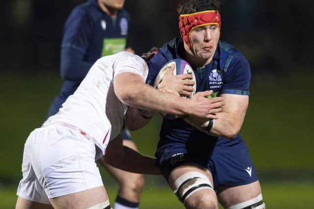 Scotlands Connor Boyle is tackled by James Whitcombe of England in last nights U20 clash. Picture: SNS/SRU
