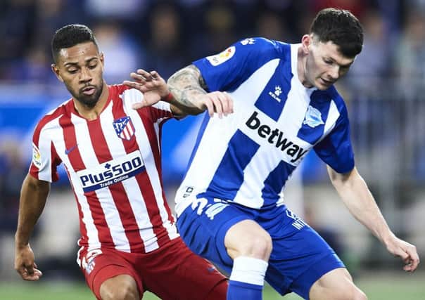 Scotland winger Oliver Burke, right, is playing in Spain for Alaves. Picture: Juan Manuel Serrano Arce/Getty Images