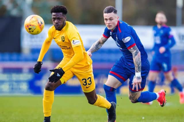 Steve Lawson and Inverness attacker Miles Storey battle for possession. Picture: SNS
