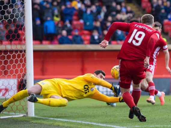Lewis Ferguson fails to find the back of the net past Kilmarnock goalkeeper Laureniu Brnescu. Picture: SNS