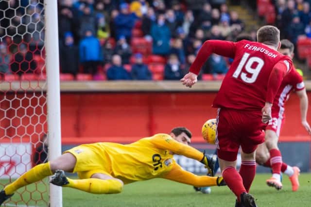 Lewis Ferguson fails to find the back of the net past Kilmarnock goalkeeper Laureniu Brnescu. Picture: SNS