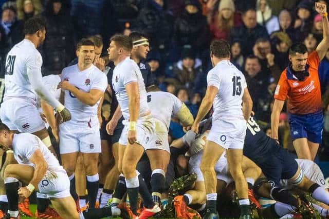 England players celebrate Ellis Genge's late winning try at a windswept and rain-soaked BT Murrayfield. Picture: SRU/SNS