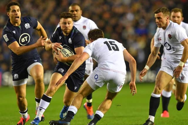 Scotland scrum-half Ali Price takes the game to England at BT Murrayfield. Picture: Paul ELLI/AFP