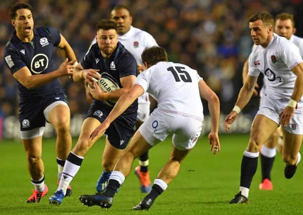 Scotland scrum-half Ali Price takes the game to England at BT Murrayfield. Picture: Paul ELLI/AFP