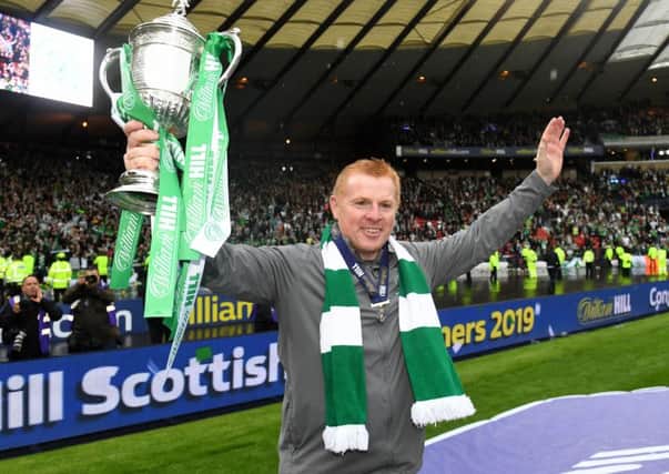 Celtic manager Neil Lennon with the Scottish Cup following victory over Hearts in last year's final. His side will face St Johnstone in this season's quarter-final. Picture: SNS.