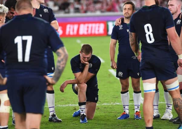 Finn Russell bowed in sorrow after  defeat by Japan in the World Cup. Picture: SNS.