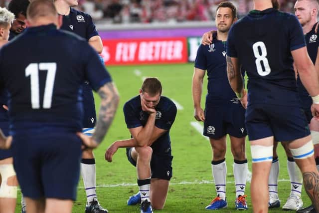Finn Russell bowed in sorrow after defeat by Japan in the World Cup. Picture: SNS.