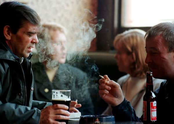 The Government is being urged to ban smoking in public places after the first major study by one of its committees reports that passive smoking does cause heart disease and lung cancer.