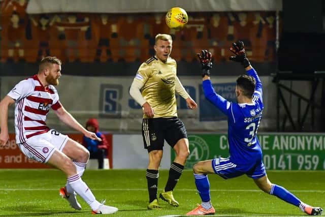 Curtis Main opens the scoring for Aberdeen with a deft chip after 15 minutes in their 3-1 victory at the FOYS Stadium last night. Picture: SNS.