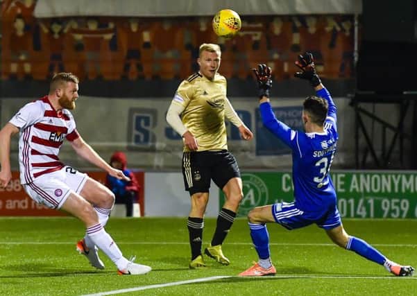 Curtis Main opens the scoring for Aberdeen with a deft chip after 15 minutes in their 3-1 victory at the FOYS Stadium last night. Picture: SNS.