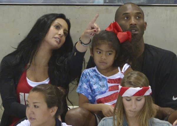 Kobe Bryant with his wife Vanessa and daughter Gianna pictured in 2012 (Picture: Mark J. Terrill/AP)