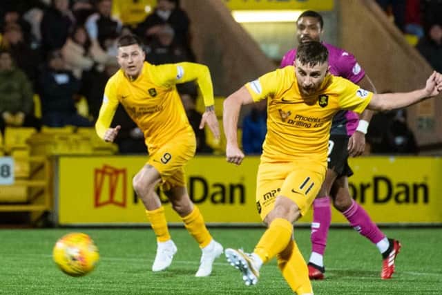 Livingston's Steven Lawless opens the scoring from the penalty spot. Picture: SNS