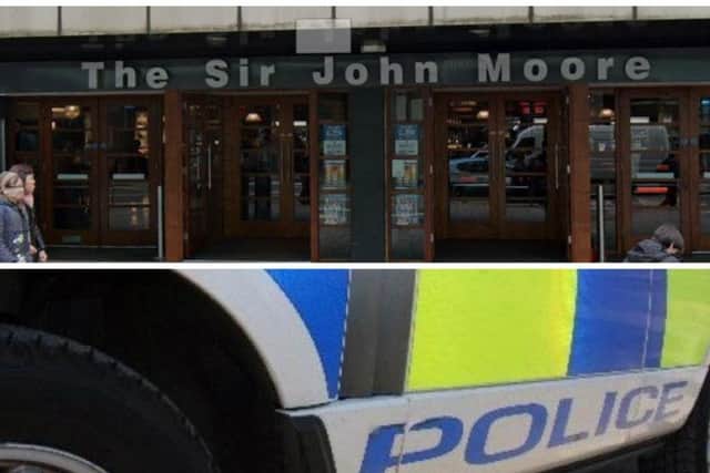 ore than 30 police officers andat least 16 squad cars descended on the Sir John Moore pub on Argyle Street